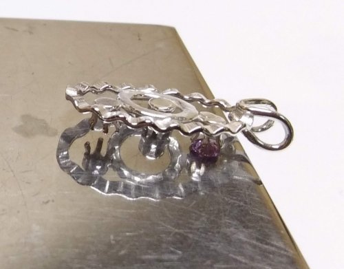 Judy Larson's Mike's Surpirise Claire's Ripple Pendant - , Contemporary Wire Jewelry, Jump Rings, Jump Ring, Making Jump Rings, Butane Torch, Soldering, Solder, Place the snap set back on the stone and push until a click is heard.